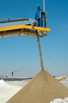 Dried limestone is conveyed onto the storage slab from where tipper trucks are loaded for delivery to clients